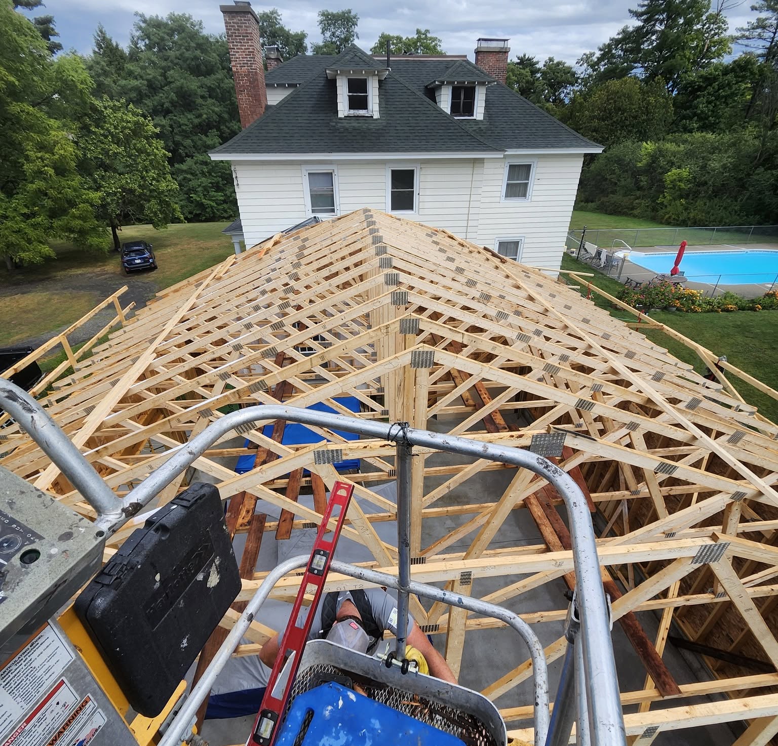 Timber roof framing in progress on a Dack Builders construction project